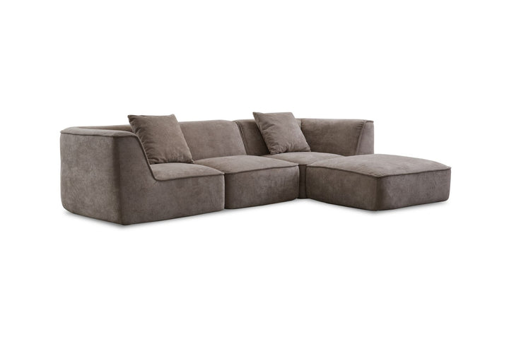 Modern grey sectional sofa with plush cushions and chaise lounge on white background