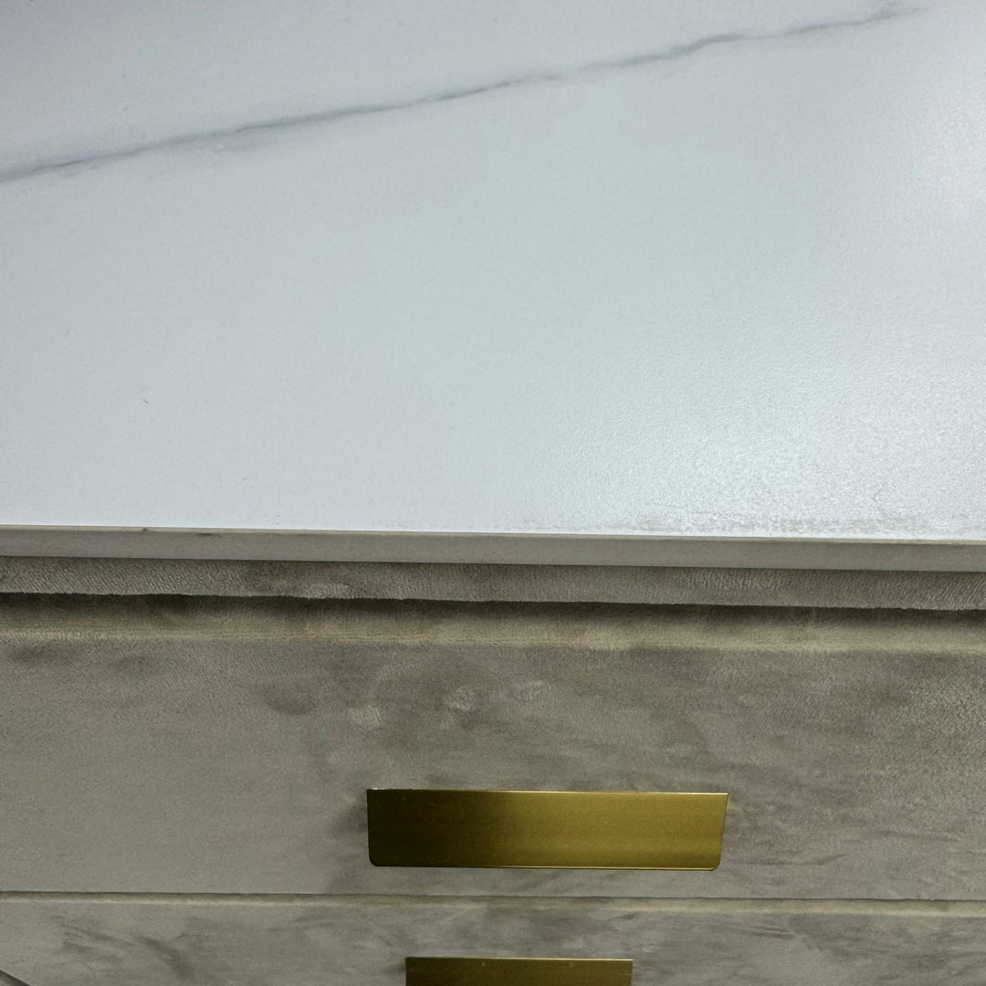 Modern velvet drawer chest with gold handles and white marble top