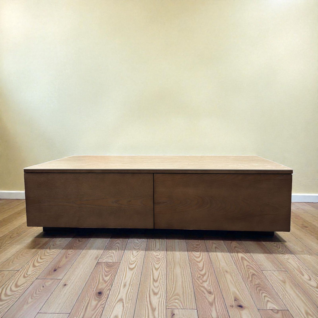 Modern rectangular wooden coffee table with storage on hardwood floor