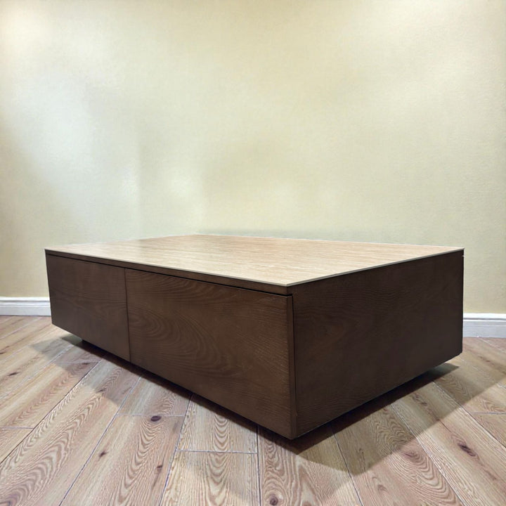Modern rectangular wooden coffee table with storage on light wood floor