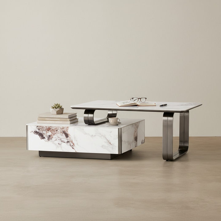 Modern marble coffee table with metal legs, books, cup, and plant in a minimalist room