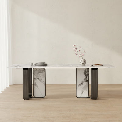 Modern marble dining table with decorative vase and dishes in minimalist room