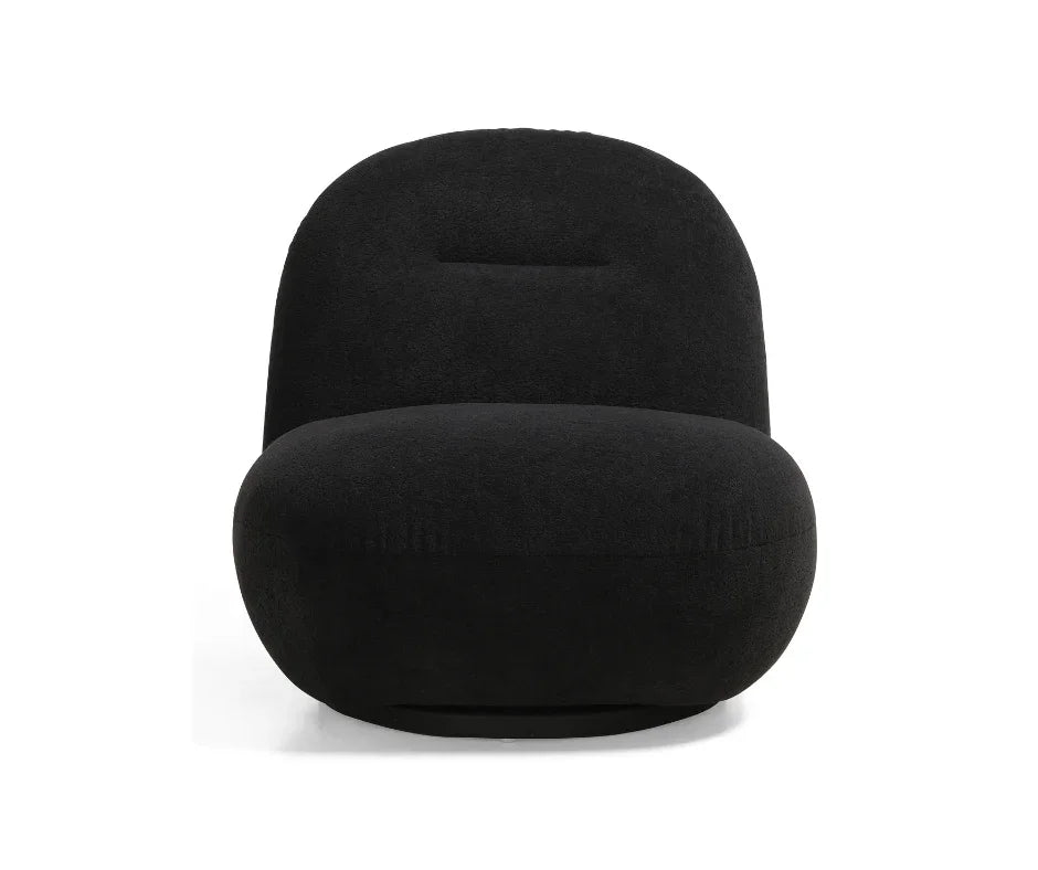 Modern black accent chair with rounded, plush design and armless silhouette