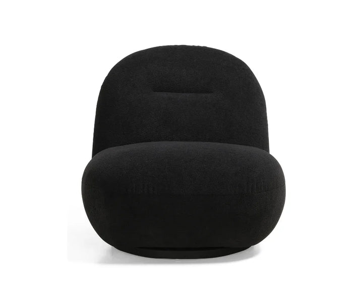 Modern black accent chair with rounded, plush design and armless silhouette